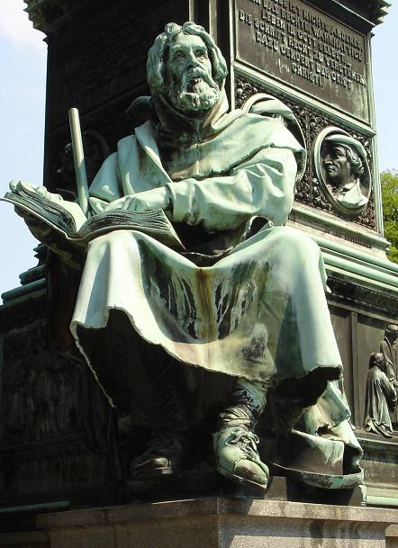 Valdes (Peter Waldo) with an open book: bronze from Ernst Rietschel’s Luther Monument at Worms, unveiled 1868, via Wikimedia Commons